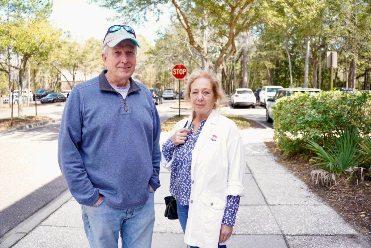 Michael and Jan stand outside the polling place at the Johns Island Library in Johns Island, S.C., on Feb. 24, 2024. (Ivan Pentchoukov/The Epoch Times)