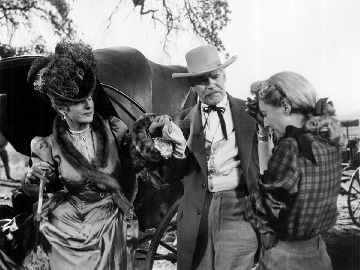 (L–R) Flo Burnett (Judith Anderson) arrives, upending the lives of J.C. (Walter Huston) and Vance Jeffords (Barbara Stanwyck), in “The Furies” (Paramount Pictures)