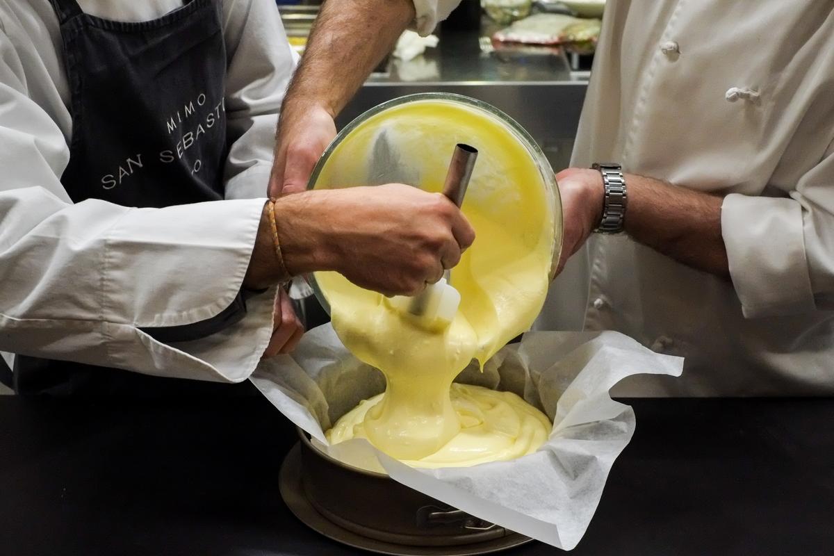 The pros demonstrate making Basque cheesecake at Mimo, a cooking school in Donostia-San Sebastián. (Courtesy of Mimo)