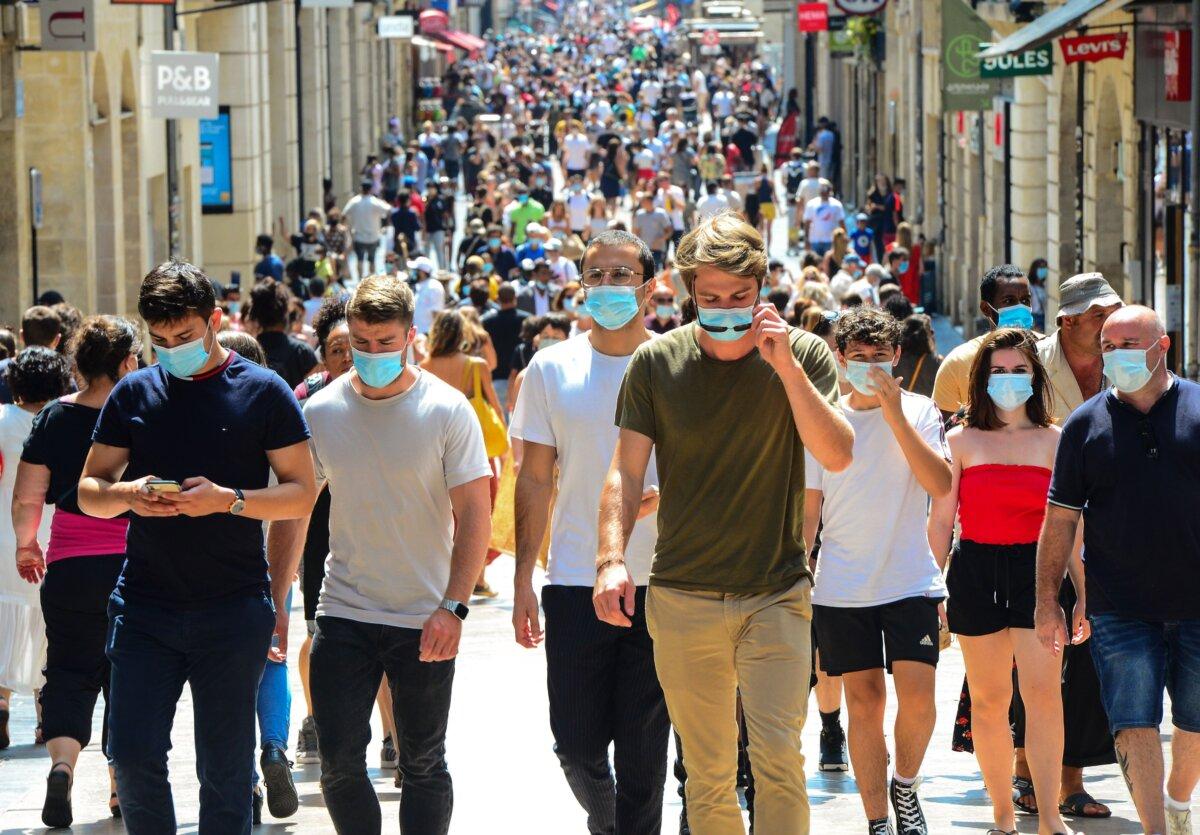 People stroll down Bordeaux's main shopping street, Sainte-Catherine, where wearing a mask is compulsory to prevent the spread of COVID-19, in France on Aug. 15, 2020. (Mehdi Fedouach/AFP via Getty Images)