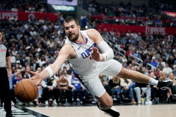 Los Angeles Clippers center Ivica Zubac jumps for a loose ball during the first half of an NBA basketball game against the Sacramento Kings in Los Angeles on Feb. 25, 2024. (Ryan Sun/AP Photo)