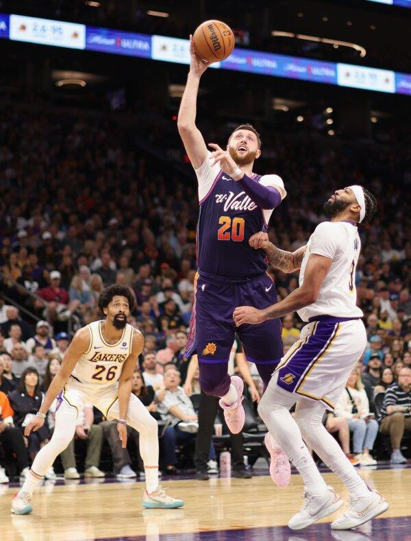 Jusuf Nurkic (20) of the Phoenix Suns attempts a shot over Anthony Davis (3) of the Los Angeles Lakers during the second half of the NBA game in Phoenix on Feb. 25, 2024. (Christian Petersen/Getty Images)