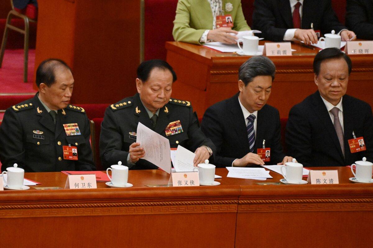(L-R) Vice Chairmen of the Central Military Commission of the People's Republic of China He Weidong and Zhang Youxia, CPC Central Committee Political Bureau member Chen Wenqing and Tianjin Communist Party Secretary Chen Miner attend the closing session of the National People's Congress (NPC) at the Great Hall of the People in Beijing on March 13, 2023. (Noel Celis/POOL/AFP via Getty Images)