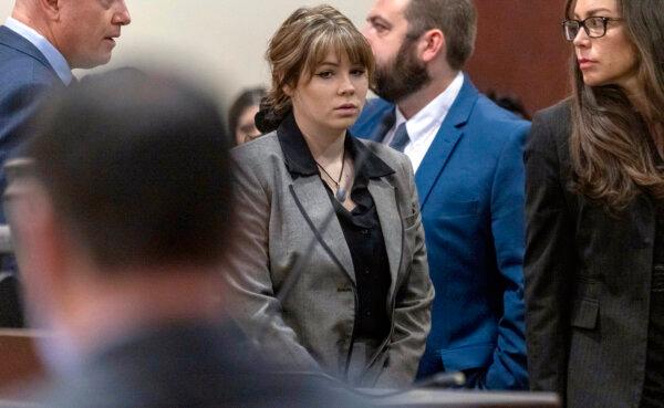 Defendant Hannah Gutierrez-Reed walks back to her seat after speaking with District Judge Mary Marlowe Sommer before her trial at District Court in Santa Fe, N.M., on Feb. 26, 2024. (Luis Sánchez Saturn0/Pool/Santa Fe New Mexican via AP)