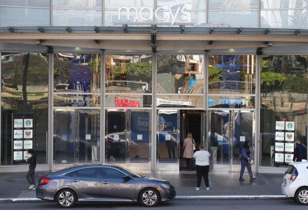 Pedestrians walk by a Macy's store in San Francisco on Feb. 27, 2024. (Justin Sullivan/Getty Images)