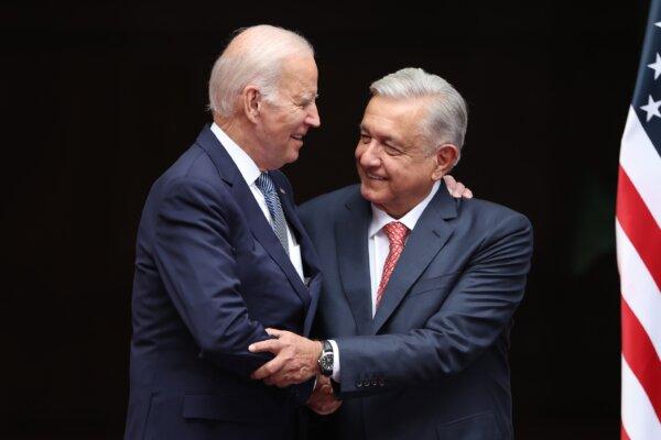 U.S. President Joe Biden (L) and Mexican President Andres Manuel Lopez Obrador (R) hug during a welcome ceremony as part of the 2023 North American Leaders Summit at Palacio Nacional in Mexico City, Mexico, on Jan. 9, 2023. (Hector Vivas/Getty Images)