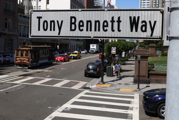 A cable car passes by Tony Bennett Way in front of the Fairmont Hotel on July 21, 2023, in San Francisco. (Justin Sullivan/Getty Images/TNS)