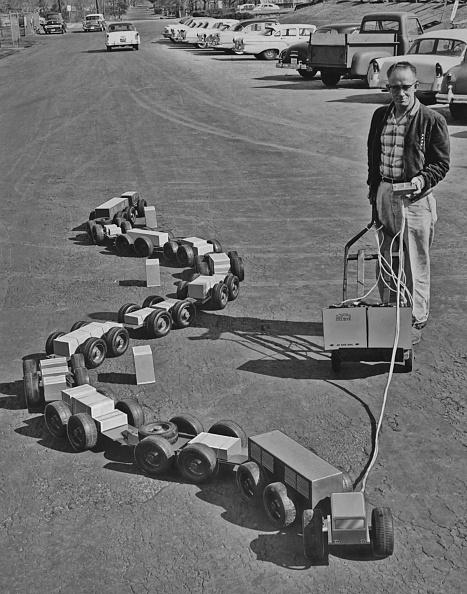 An engineer with an operating model for a 52-wheeled, 450-foot-long vehicle designed by R.G. LeTourneau. The vehicle had a unique ability to track around obstacles and was intended to be powered by conventional or nuclear means. (FPG/Archive Photos/Getty Images)
