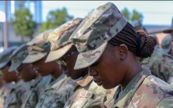 Soldiers with the 787th Combat Sustainment Support Battalion bow their heads during a farewell ceremony prayer at its headquarters in Dothan, Ala., on June 3, 2023. (Master Sgt. Gary A. Witte, U.S. Army)