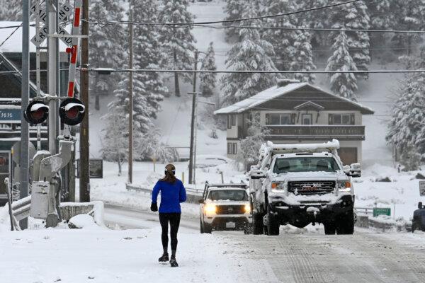 Local runner Jenelle Potvin goes on her daily jog along Bridge Street in Truckee, Calif., on March 1, 2024. (Andy Barron/AP Photo)
