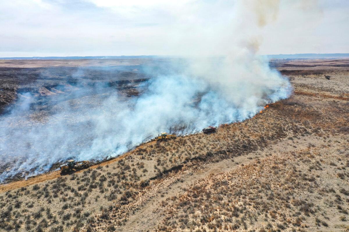 Firefighters battle the Smokehouse Creek Fire north of Canadian, Texas, Wednesday, Feb. 28, 2024 (AP Photo/David Erickson)