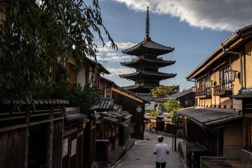 People pass next to Hokan-ji Temple (also known as Yasaka Pagoda) in Kyoto, Japan, on Oct. 14, 2021. (Carl Court/Getty Images)