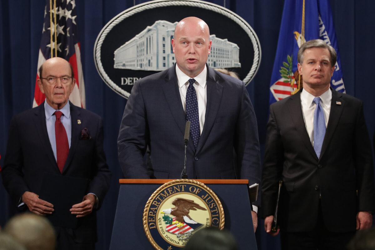 Acting U.S. Attorney General Matthew Whitaker (C) announces new criminal charges against Chinese telecommunications giant Huawei with Federal Bureau of Investigation Director Christopher Wray (R) and Commerce Secretary Wilbur Ross at the Department of Justice January 28, 2019 in Washington, DC. (Chip Somodevilla/Getty Images)
