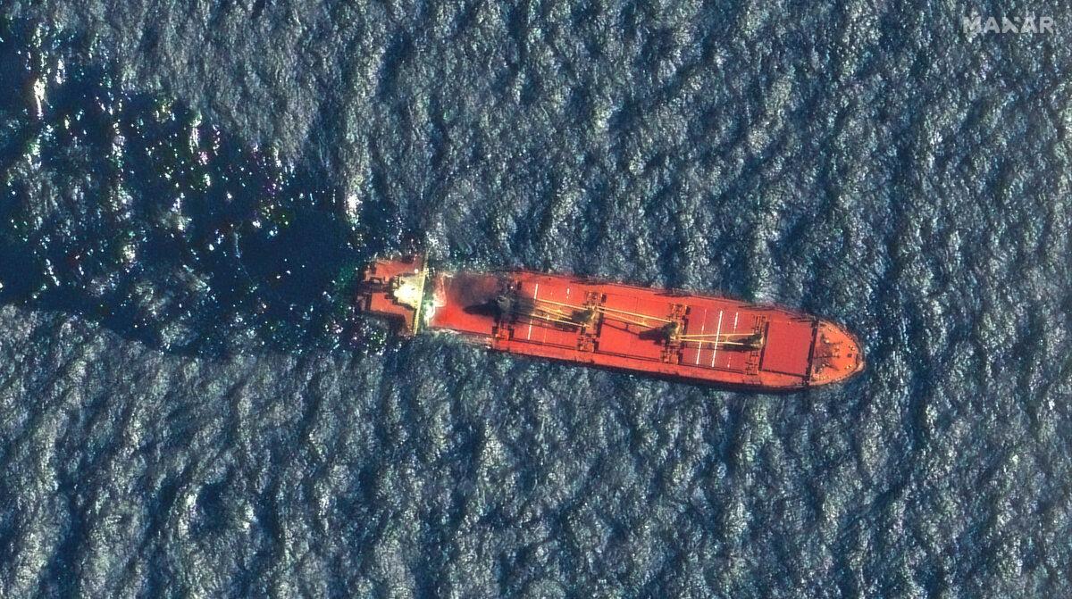 A satellite image taken by Maxar Technologies shows the Belize-flagged ship Rubymar in the Red Sea on March 1, 2024, taking on water after sustaining damage from a Houthi attack. (Maxar Technologies via AP)