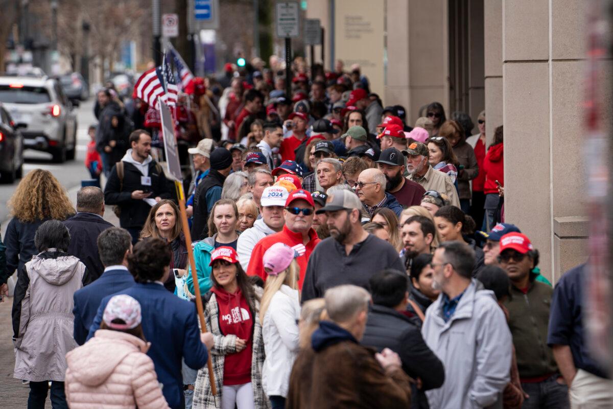 Supporters of 2024 Republican presidential candidate President Donald Trump wait outside the Greater Richmond Convention Center in Richmond, Va., on March 2, 2024. (Madalina Vasiliu/The Epoch Times)