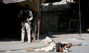 Hundreds of Inmates Flee After Armed Gangs Storm Haiti’s Main Prison, Leaving Bodies Behind