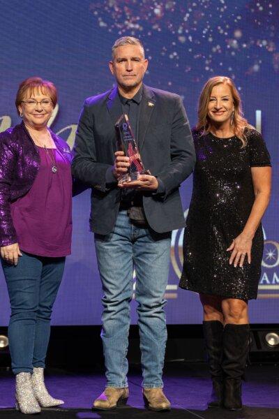 Kimberly Fletcher (L), actor Jim Caviezel, and Debbie Kraulidis (R) at Moms for America's 20th Anniversary Summit & Gala in Dallas on Feb. 29, 2024. (Moms for America)