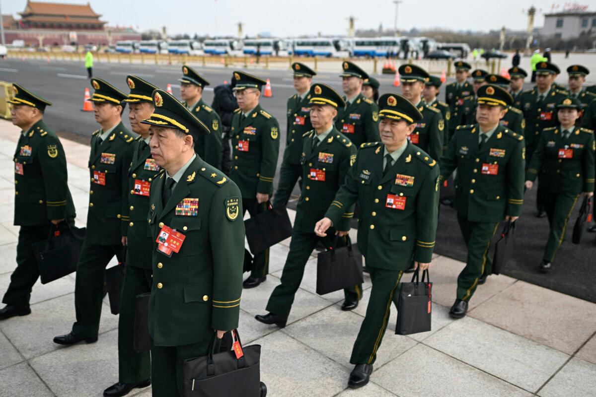 Members of a military delegation arrive for a meeting before the opening ceremony of the Chinese People's Political Consultative Conference (CPPCC) at the Great Hall of the People in Beijing on March 4, 2024. (Wang Zhao/AFP via Getty Images)