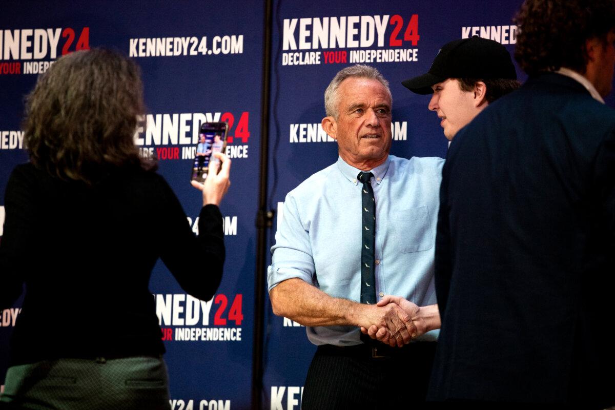 Independent presidential candidate Robert F. Kennedy Jr. poses with supporters during a meet-and-greet after a voter rally at St. Cecilia Music Center in Grand Rapids, Mich., on Feb. 10, 2024. (Emily Elconin/Getty Images)
