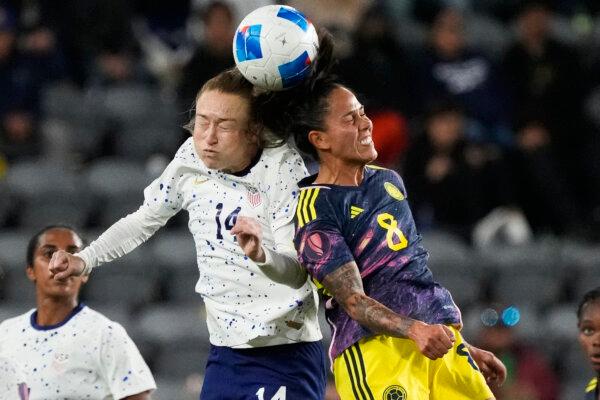 United States midfielder Emily Sonnett (L) vies for a a head ball against Colombia midfielder Marcela Restrepo during the second half of a CONCACAF Gold Cup women's soccer tournament quarterfinal in Los Angeles on March 3, 2024. (Marcio Jose Sanchez/AP Photo)