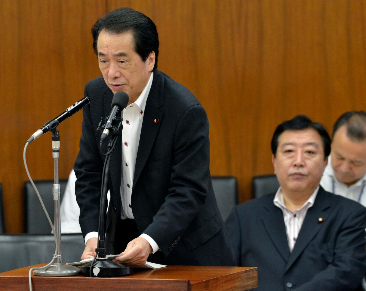Japanese Prime Minister Naoto Kan (L) talks next to Finance Minister Yoshihiko Noda (R), as they attend the Lower House's fiscal and monetary policies committee session at the national Diet in Tokyo on Aug. 10, 2011. (Yoshikazu Tsuno/AFP via Getty Images)