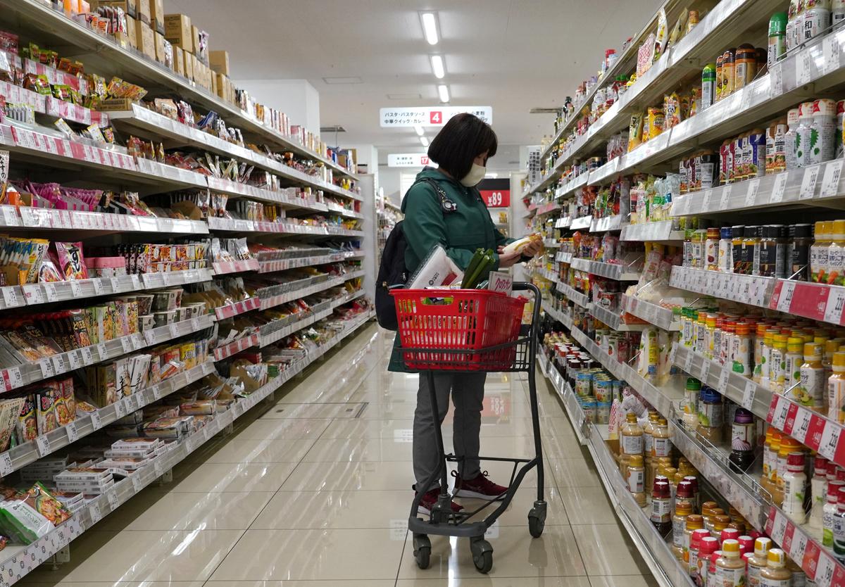 A customer picks up a seasoning at a supermarket in Tokyo, on Feb. 27, 2024. (Kazuhiro Nogi/ AFP via Getty Images)