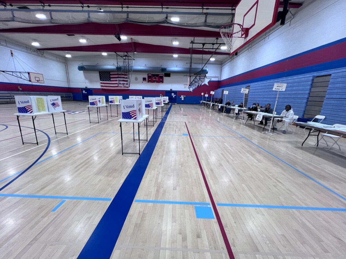 Poll workers staff the polling station in the gymnasium of OC Actis Jr. High School in Bakersfield, Calif., on Mar. 5, 2024. (Lawrence Wilson/The Epoch Times)