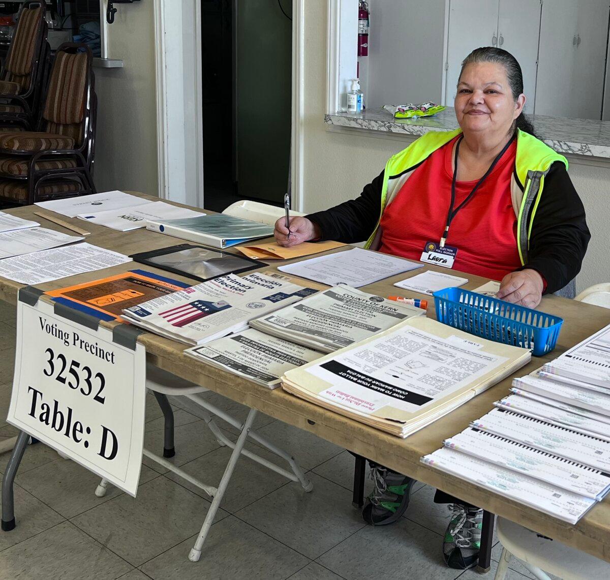 Laura Barunda, 63, of Lamont, works the polls at Faith Temple Church in Bakersfield, Calif., on Mar. 5, 2024. (Lawrence Wilson/The Epoch Times)