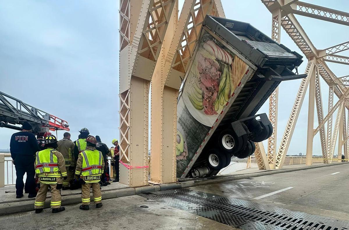 A semi-truck lodged against the beam of Clark Memorial Bridge. (Courtesy of Louisville Division of Fire)