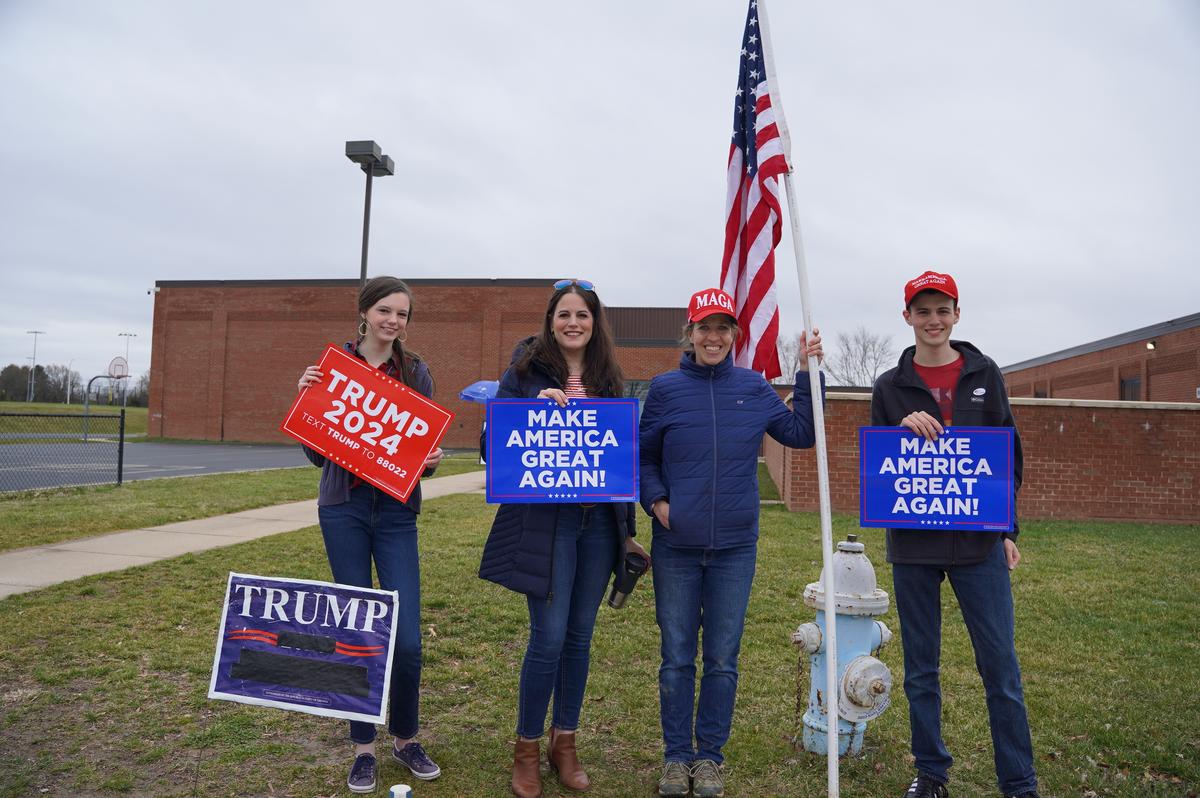 Trump supporters Amelia P. (2nd L), Heather W. (2nd R), and their children at a 2024 presidential primary polling station at Lovettsville Elementary School in Lovettsville, Va., on March 5, 2024. (Terri Wu/The Epoch Times)