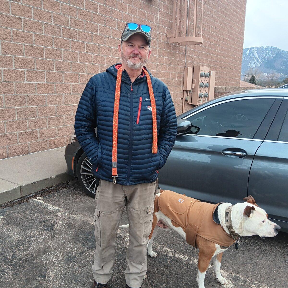 Michael Staunton with his dog, Benny, outside a polling place in Monument, Colorado, after voting on Super Tuesday, March 5, 2024. (Nathan Worcester/The Epoch Times)