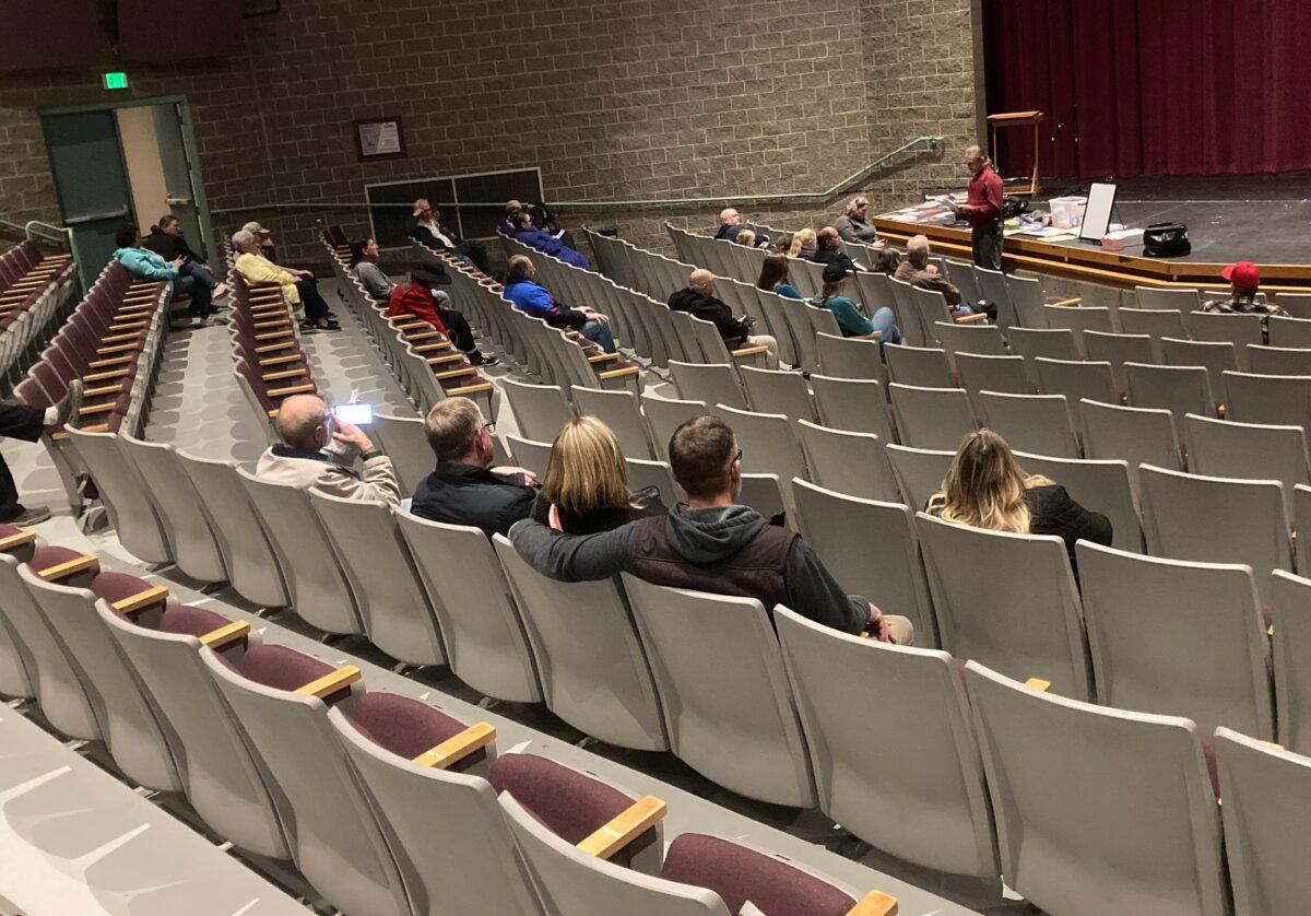 A caucus chair outlines the Utah Republican Party’s platform planks for caucus-goers during the state’s Super Tuesday GOP presidential preference poll at Hunter High School in West Valley City, south of Salt Lake City, on March 5, 2024. (The Epoch Times/John Haughey)