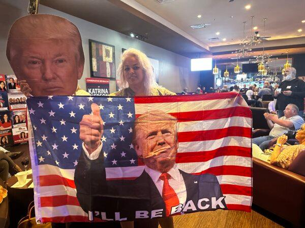 Rubia Rangel of Rockwall, Texas, stands in front of a Trump flag at a Super Tuesday watch Party on March 5, 2024. Darlene McCormick Sanchez/The Epoch Times