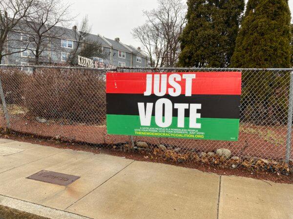 A 'Just Vote' sign in Roxbury, Boston, Mass., on Mar. 5, 2024 (Alice Giordano/The Epoch Times)