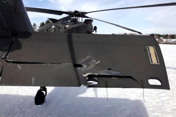 A damaged Black Hawk helicopter rests on the snow in Worthington, Mass., on March 13, 2019. (U.S. Army photograph provided by attorney Douglas Desjardins via AP)
