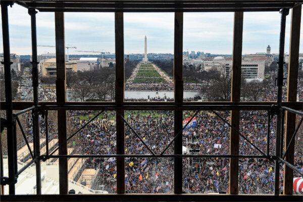 Supporters of U.S. President Donald Trump are seen from behind scaffolding as they gather outside the U.S. Capitol's Rotunda in Washington on Jan. 6, 2021. (Olivier Douliery/AFP via Getty Images)
