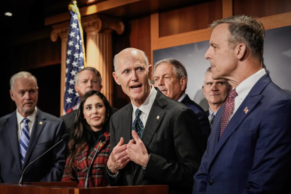 Sen. Rick Scott (R-Fla.) (C) speaks during a news conference with members of the House Freedom Caucus at the U.S. Capitol in Washington, on Nov. 29, 2023. (Drew Angerer/Getty Images)