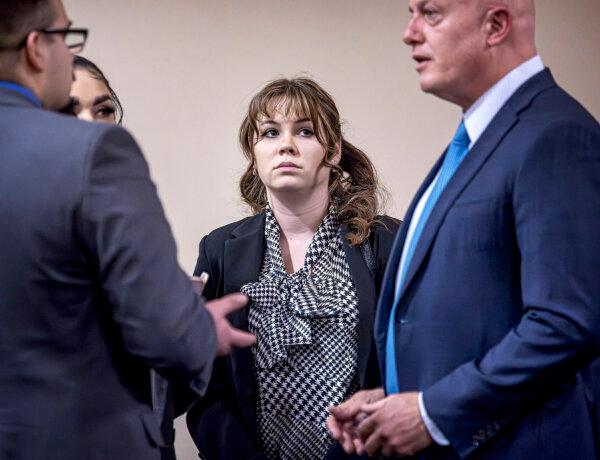 "Rust" movie armorer Hannah Gutierrez-Reed (C) talks with her attorney Jason Bowles (R) and her defense team during her involuntary manslaughter trial at the First Judicial District Courthouse in Santa Fe, N.M., on March 5, 2024. (Jim Weber/Pool/Santa Fe New Mexican via AP)
