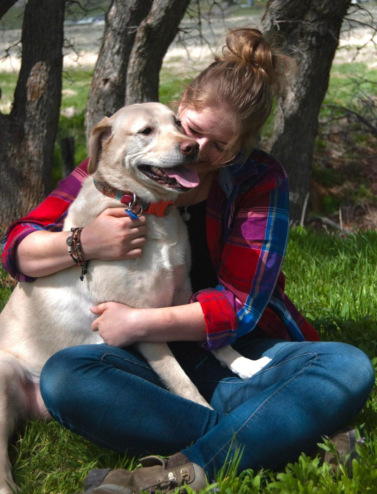 Courtney Earnhart with her dog, Dakota. (SWNS)