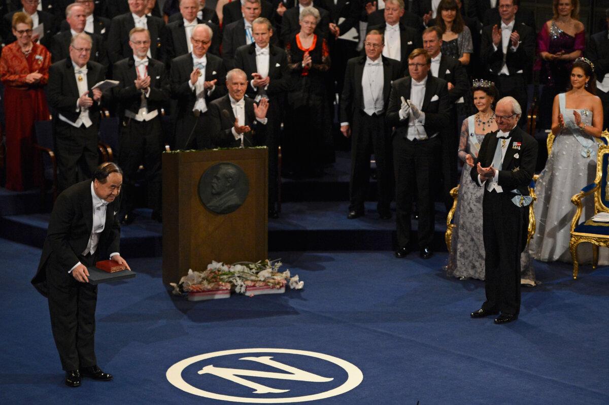 Nobel Prize in Literature laureate, author Mo Yan of China (L) acknowledges applause after he received his Nobel Prize from King Carl XVI Gustaf of Sweden (2nd R) as Queen Silvia of Sweden (3rd R) and Princess Madeleine of Sweden (R) look on, during the Nobel Prize Ceremony at Concert Hall in Stockholm on Dec. 10, 2012. (Pascal Le Segretain/Getty Images)