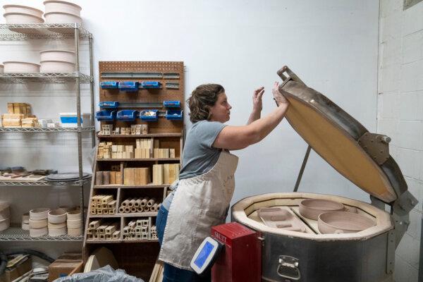 Potter Cara Mach closes the electric kiln at Clay Coyote in Hutchinson, Minnesota, Friday, Jan. 26, 2024. (Leila Navidi/Minneapolis Star Tribune/TNS)