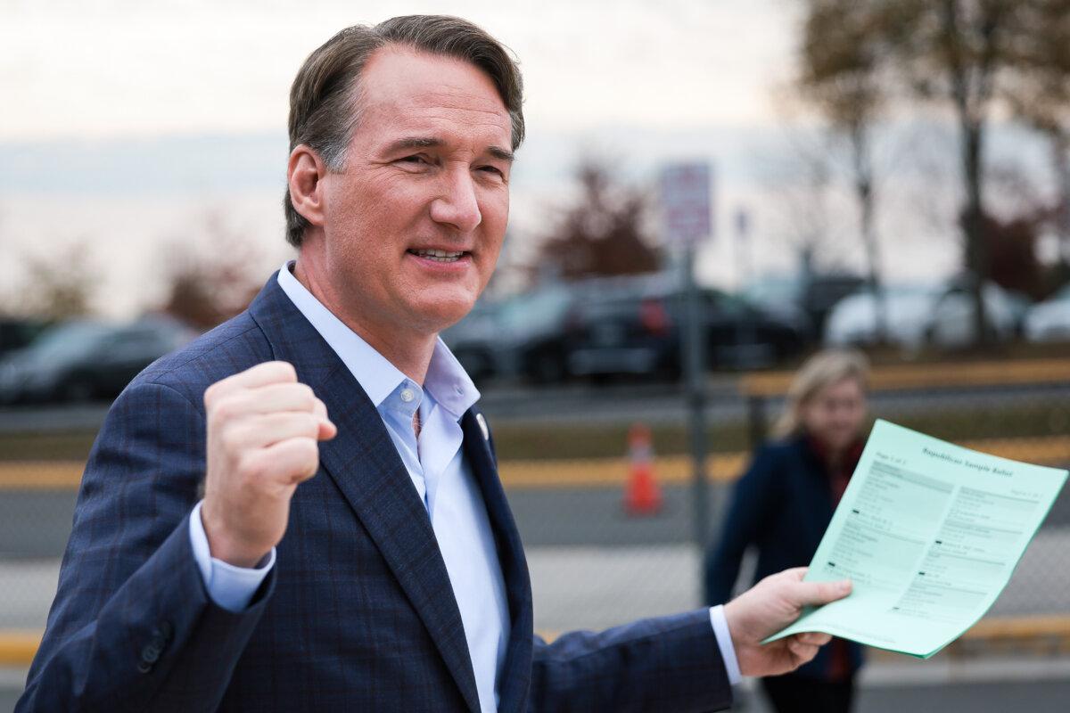 Virginia Governor Glenn Youngkin gestures to supporters while arriving at Piney Branch Elementary School in Bristow, Va., on Nov. 7, 2023. (Win McNamee/Getty Images)