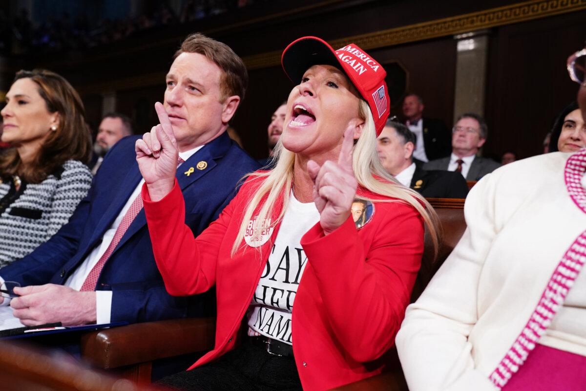 Rep. Marjorie Taylor Greene (R-Ga.) shouts at President Joe Biden as he delivers the State of the Union address before a joint session of Congress in the House chamber at the Capital building on March 7, 2024. (Shawn Thew-Pool/Getty Images)