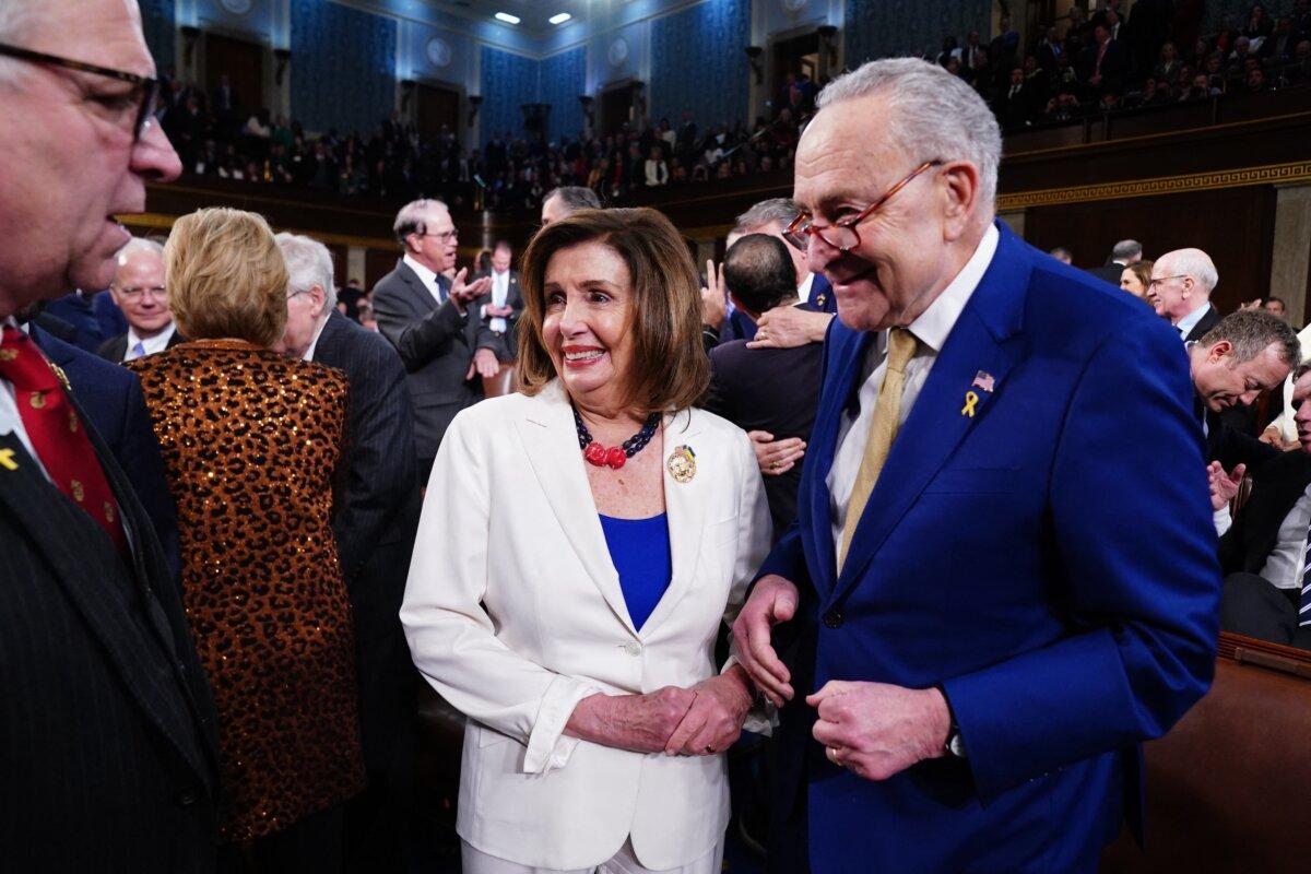 Senate Majority Leader Chuck Schumer (R) chats with Democratic Representative from California Nancy Pelosi (C) in the House of Representatives ahead of President Joe Biden's third State of the Union in the House Chamber of the Capitol, on March 7, 2024. (Shawn Thew/Pool/AFP)
