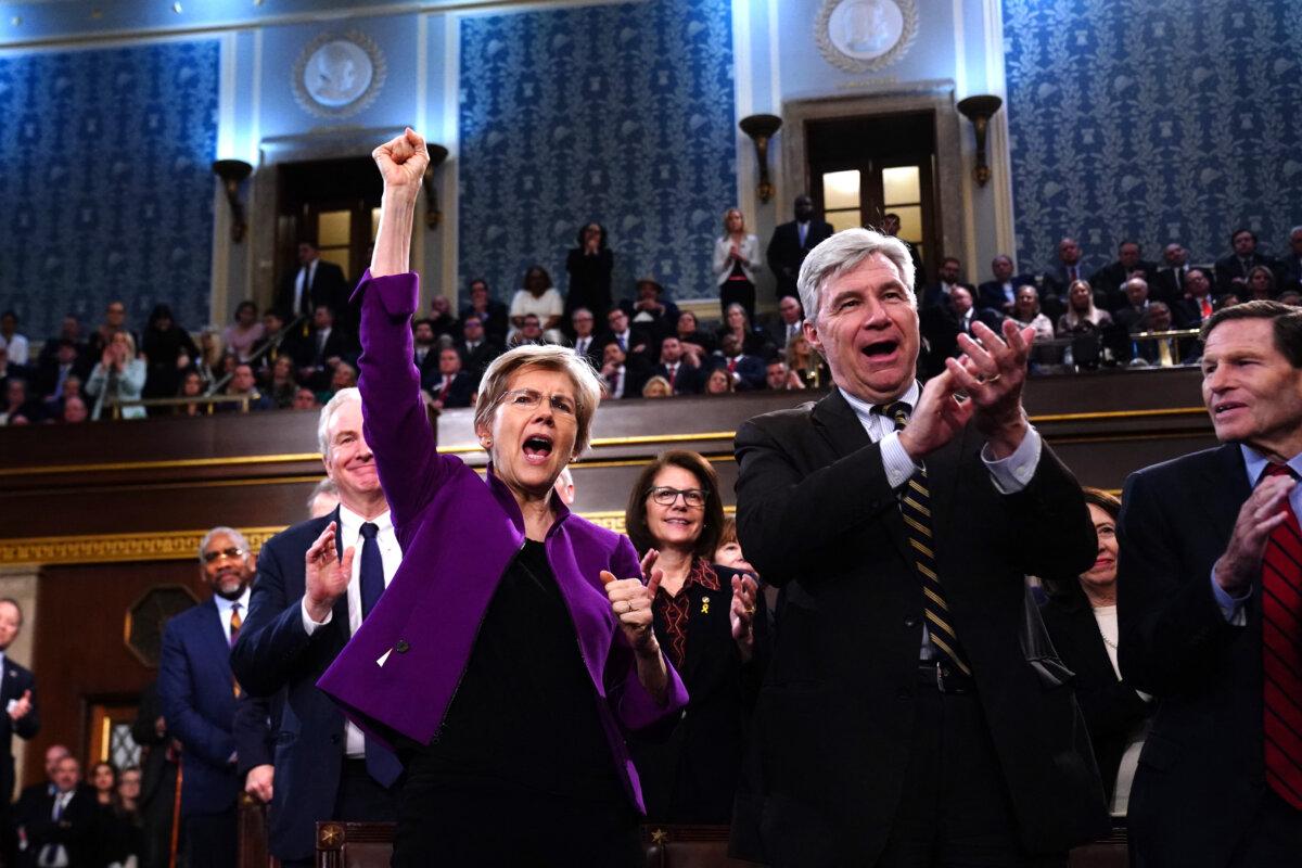 Democratic Senators Elizabeth Warren from Massachusetts (L) and Sheldon Whitehouse from Rhode Island (L) cheer as US President Joe Biden delivers his third State of the Union at the Capitol, on March 7, 2024. (Shawn Thew/Pool/AFP via Getty Images)