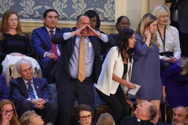 A heckler, identified as Steve Nikoui, the father of the late Marine Corps Lance Cpl. Kareem Nikoui, yells out as President Joe Biden delivers the State of the Union address during a joint meeting of Congress in the House chamber at the U.S. Capitol in Washington on March 7, 2024. (Alex Wong/Getty Images)