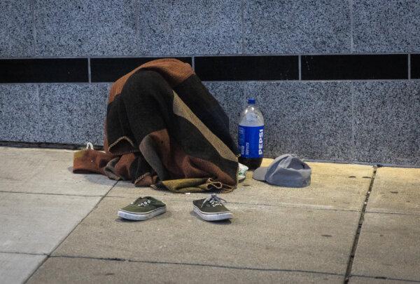 California Stopped Tracking Billions in Homeless Spending, Audit Shows | USNN World News A homeless person covers up with a blanket in San Francisco on March 7, 2024. (John Fredricks/The Epoch Times)