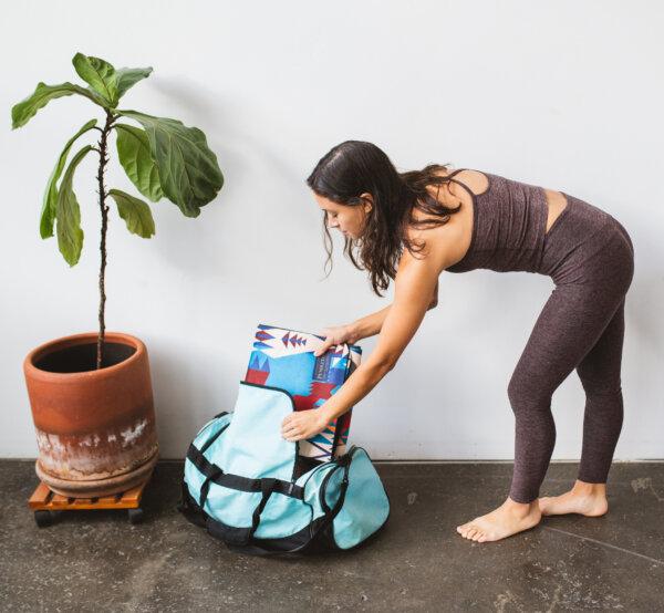 The Yune yoga mat folds into a suitcase for easy packing. (Photo courtesy of Yune Yoga)