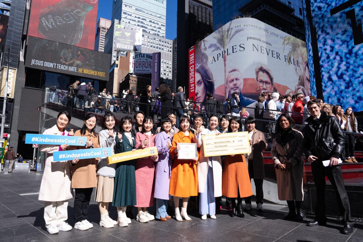 Staff of the New Century Films, winner of the “Kindness Together Group Award,” at Gan Jing World's "Kindness Is Cool Video Awards" ceremony at Times Square, New York, on March 8, 2024. (Larry Dye/The Epoch Times)