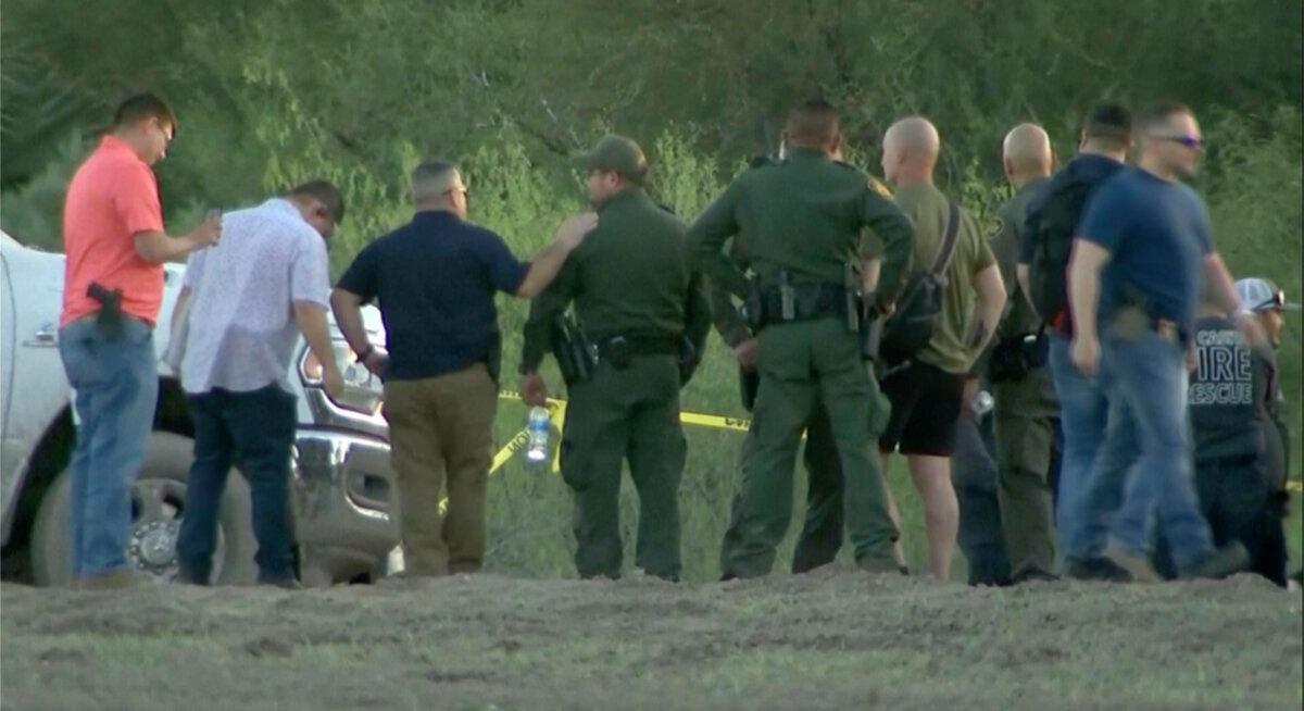 Authorities stage near where a helicopter flying over the U.S.–Mexico border in Texas crashed, killing two National Guard soldiers and a Border Patrol agent, on March 8, 2024, in a still from video. (KRGV via AP)